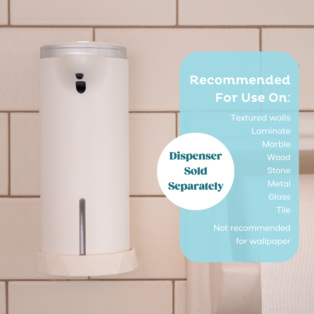 Auto foam dispenser on wall mount next to toilet paper. The wall mount is recommended for use on textured walls, laminate, marble, wood, stone, metal, glass, and tile. It is not recommended for use on wallpaper.